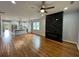Open floor plan featuring hardwood floors, a modern fireplace, and updated kitchen in this home at 1766 W Lyle W Ave, College Park, GA 30337