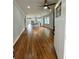 Spacious open-concept living room and kitchen, showcasing hardwood floors and a bright, airy atmosphere at 1766 W Lyle W Ave, College Park, GA 30337
