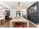 Elegant dining room with a long table and stylish chandelier, perfect for gatherings at 1443 Fama Ne Dr, Atlanta, GA 30329