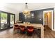 Stylish dining room featuring a large table, hardwood floors, and modern decor at 1443 Fama Ne Dr, Atlanta, GA 30329