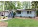 Charming one-story home with a well-manicured lawn and inviting entrance at 1443 Fama Ne Dr, Atlanta, GA 30329