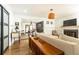 Bright and inviting living room featuring hardwood floors, fireplace, and modern lighting at 1443 Fama Ne Dr, Atlanta, GA 30329
