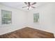 Cozy bedroom with hardwood floors, ceiling fan, and natural light from two windows at 1636 Mary George Nw Ave, Atlanta, GA 30318