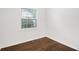 Bedroom features a window with view and wood floor at 1636 Mary George Nw Ave, Atlanta, GA 30318