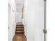 Hallway with hardwood floors and stairs leading to the upper level at 1636 Mary George Nw Ave, Atlanta, GA 30318