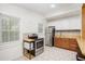 Bright kitchen with stainless steel appliances, tile floor, and ample natural light at 1636 Mary George Nw Ave, Atlanta, GA 30318
