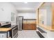 Updated kitchen with stainless steel appliances, wood countertops, and white cabinets at 1636 Mary George Nw Ave, Atlanta, GA 30318