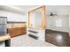 Stylish kitchen featuring stainless steel appliances and open layout to living area at 1636 Mary George Nw Ave, Atlanta, GA 30318