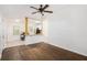 Inviting living room with hardwood floors, ceiling fan, and an open view to the kitchen area at 1636 Mary George Nw Ave, Atlanta, GA 30318