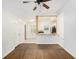 Bright living room with hardwood floors, opening to a kitchen with stainless steel appliances at 1636 Mary George Nw Ave, Atlanta, GA 30318