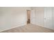 Carpeted bedroom with two doors and neutral walls at 225 Limestone Cir, Conyers, GA 30013
