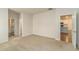 Spacious bedroom featuring neutral carpet and a view into the kitchen at 225 Limestone Cir, Conyers, GA 30013