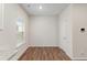 Bright breakfast nook featuring wood-look floors and a window with a view at 225 Limestone Cir, Conyers, GA 30013