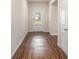Bright hallway features hardwood floors and a clear view to the front door at 225 Limestone Cir, Conyers, GA 30013