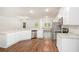 A kitchen featuring white cabinets, stainless steel appliances, and granite countertops at 225 Limestone Cir, Conyers, GA 30013