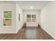 Bright and airy living room featuring hardwood floors, and several windows at 225 Limestone Cir, Conyers, GA 30013