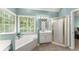 Bright bathroom featuring double vanity, garden tub, and a separate shower, perfect for relaxation at 2342 Tall Timbers Ln, Marietta, GA 30066