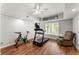 Exercise room featuring a treadmill, exercise bike, wood floors, and a chair at 2342 Tall Timbers Ln, Marietta, GA 30066