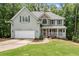 Charming home with well-manicured lawn, stone accents, and a front porch at 2342 Tall Timbers Ln, Marietta, GA 30066