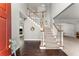 Bright foyer featuring hardwood floors, carpeted stairs, and high ceilings at 2342 Tall Timbers Ln, Marietta, GA 30066