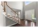 Bright foyer featuring hardwood floors, an open staircase, and high ceilings at 2342 Tall Timbers Ln, Marietta, GA 30066