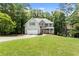 Charming two-story home with a lush green lawn at 2342 Tall Timbers Ln, Marietta, GA 30066