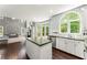 Bright kitchen view from the living room, featuring an island and stainless steel appliances at 2342 Tall Timbers Ln, Marietta, GA 30066