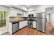 Modern kitchen with stainless steel appliances, white cabinets, and wood countertops at 2342 Tall Timbers Ln, Marietta, GA 30066