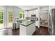 Well-lit kitchen featuring modern appliances, white cabinetry, and a view to the deck at 2342 Tall Timbers Ln, Marietta, GA 30066