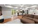 Inviting living room with kitchenette, wood floors, and a cozy sectional sofa at 2342 Tall Timbers Ln, Marietta, GA 30066