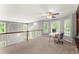 Versatile loft space with lots of windows, ceiling fan, and plenty of natural light at 2342 Tall Timbers Ln, Marietta, GA 30066