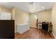 Home office with wood flooring, desk, chair, and patriotic decor at 2342 Tall Timbers Ln, Marietta, GA 30066