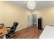 Office features wood floors, stylish lighting, desk and storage at 2342 Tall Timbers Ln, Marietta, GA 30066