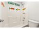 Bathroom shower and tub combo decorated with colorful fish accents at 540 Alcovy Hills Dr, Lawrenceville, GA 30045
