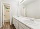 This bathroom features a double sink vanity, large mirror, and tile flooring at 540 Alcovy Hills Dr, Lawrenceville, GA 30045