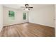 Bedroom featuring hardwood floors, natural light, and ceiling fan at 540 Alcovy Hills Dr, Lawrenceville, GA 30045