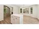Eat in kitchen with bright windows and island, connecting to the living room at 540 Alcovy Hills Dr, Lawrenceville, GA 30045