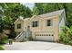 Two-story home with neutral siding, shutters, a covered entryway, and attached garage at 540 Alcovy Hills Dr, Lawrenceville, GA 30045