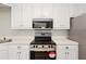Bright kitchen featuring stainless steel appliances and modern white cabinetry at 540 Alcovy Hills Dr, Lawrenceville, GA 30045