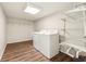 The laundry room includes a washer, dryer and built-in shelving for ample storage at 540 Alcovy Hills Dr, Lawrenceville, GA 30045