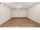 Open-concept living room with neutral walls, wood-look floors, and ceiling fan at 540 Alcovy Hills Dr, Lawrenceville, GA 30045