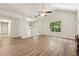 Bright living room features vaulted ceilings, modern ceiling fan, and attractive wood-look flooring at 540 Alcovy Hills Dr, Lawrenceville, GA 30045