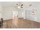 Open living room featuring hardwood floors, a ceiling fan, and access to the kitchen at 540 Alcovy Hills Dr, Lawrenceville, GA 30045