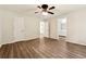 Spacious bedroom with hardwood floors and connecting doors to the bathroom and closet at 540 Alcovy Hills Dr, Lawrenceville, GA 30045