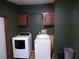 A laundry room with a washer and dryer at 2900 Hitt Rd, Cumming, GA 30041