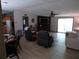 Open-concept living area with wood floors, comfortable seating, and abundant natural light at 2900 Hitt Rd, Cumming, GA 30041
