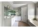 Bright bathroom featuring a soaking tub, tile floors, and a double sink vanity at 303 Roswell Green Ln, Roswell, GA 30075