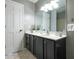 Bathroom with a dark vanity, white countertop, and updated faucet at 303 Roswell Green Ln, Roswell, GA 30075