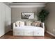 Cozy bedroom features a daybed with drawers, comfortable pillows, and stylish decor at 303 Roswell Green Ln, Roswell, GA 30075