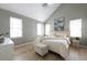 Bright bedroom featuring a vaulted ceiling, neutral tones, and ample natural light from multiple windows at 303 Roswell Green Ln, Roswell, GA 30075